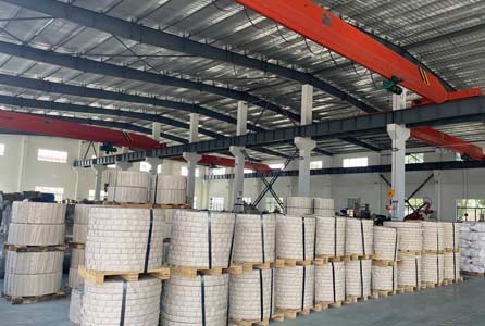 Packed tinplate coils on pallets ready for shipment in the Haida Metal factory