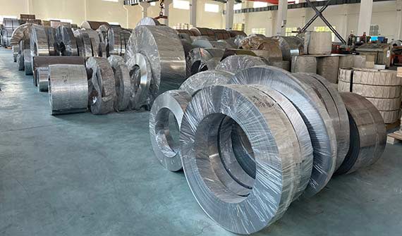 Packed steel strip and tinplate coils stored in the Haida Metal warehouse before export
